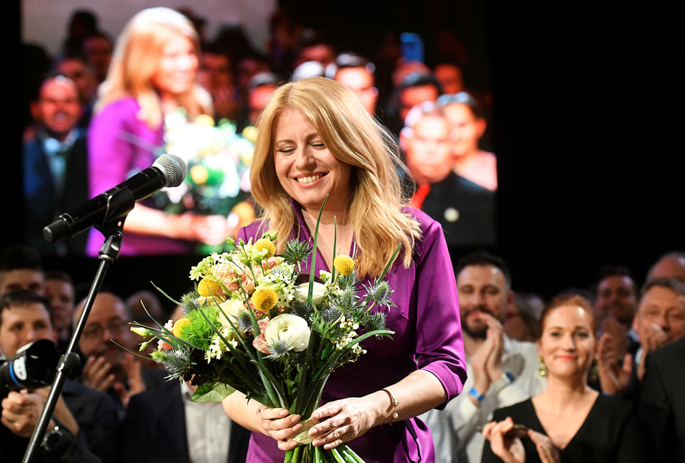 Slovakia`s presidential candidate Zuzana Caputova receives flowers after winning the presidential election, at her party`s headquarters in Bratislava, Slovakia, 30 March, 2019. Photo: Reuters