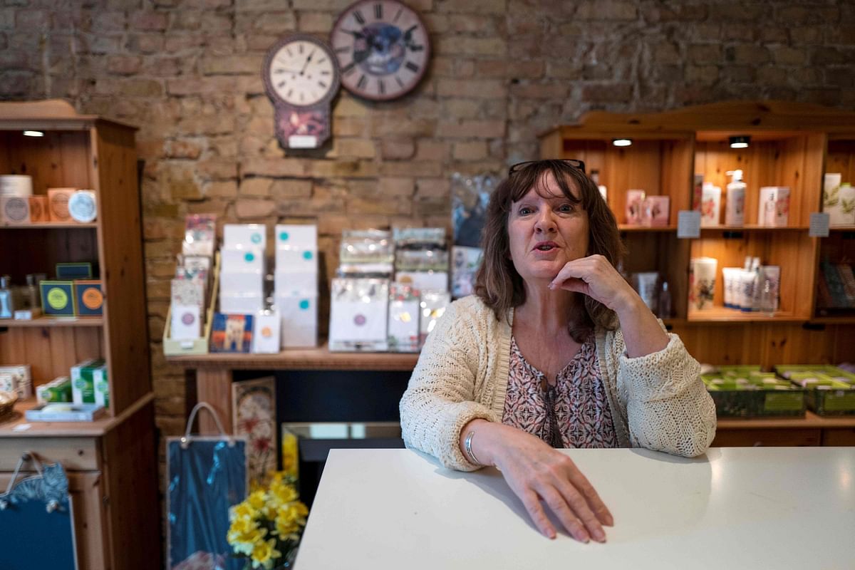 The owner, Dale Carr, answers joursnalists` questions at her shop “Broken English” shop, which sells British goods on 27 March 2019 in Berlin`s leafy district of Kreuzberg. Photo: AFP