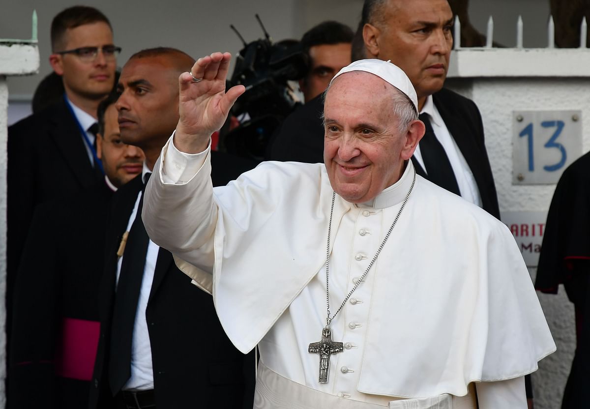 Pope Francis waves as he prepares to leave the Catholic humanitarian organisation Caritas, after meeting with migrants, in the Moroccan capital Rabat on the first day of his visit to the north African country on 30 March. Reuters File Photo