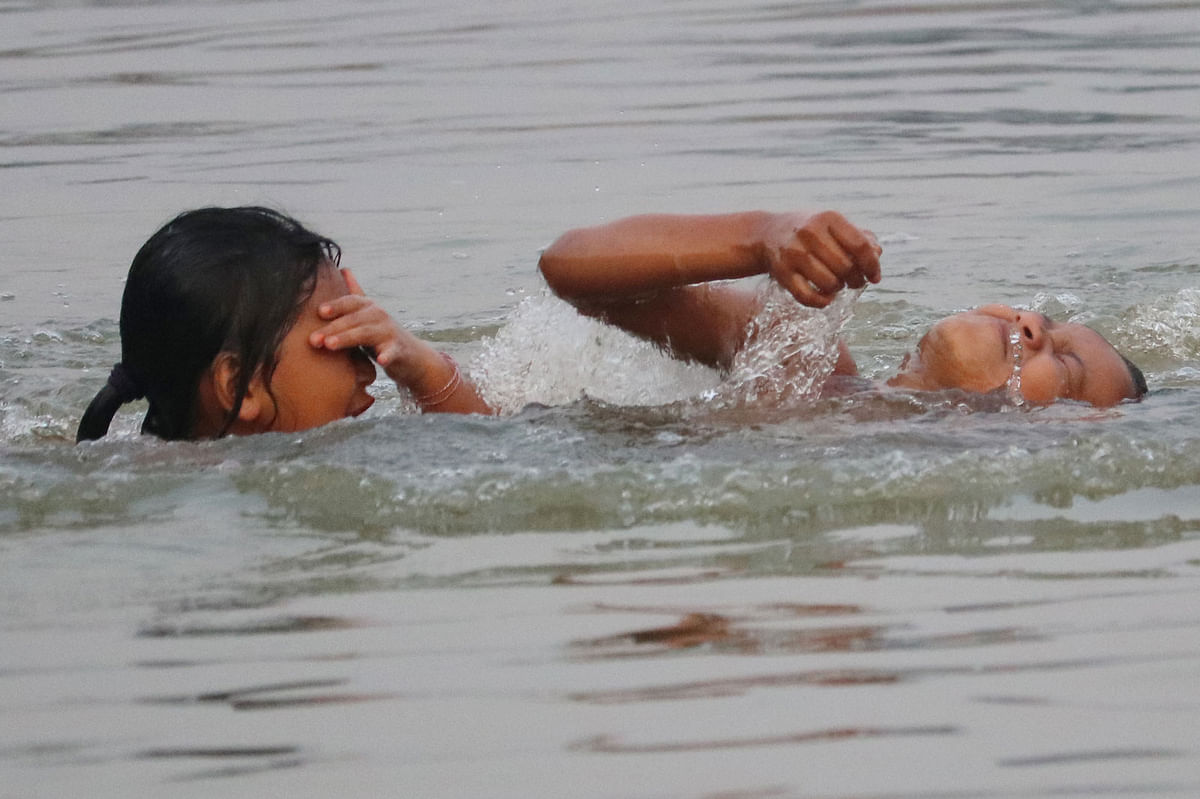 Indigenous children bathing in river Chengi at Memberpara, Khagrachhari on 31 March. Photo: Nerob Chowdhury