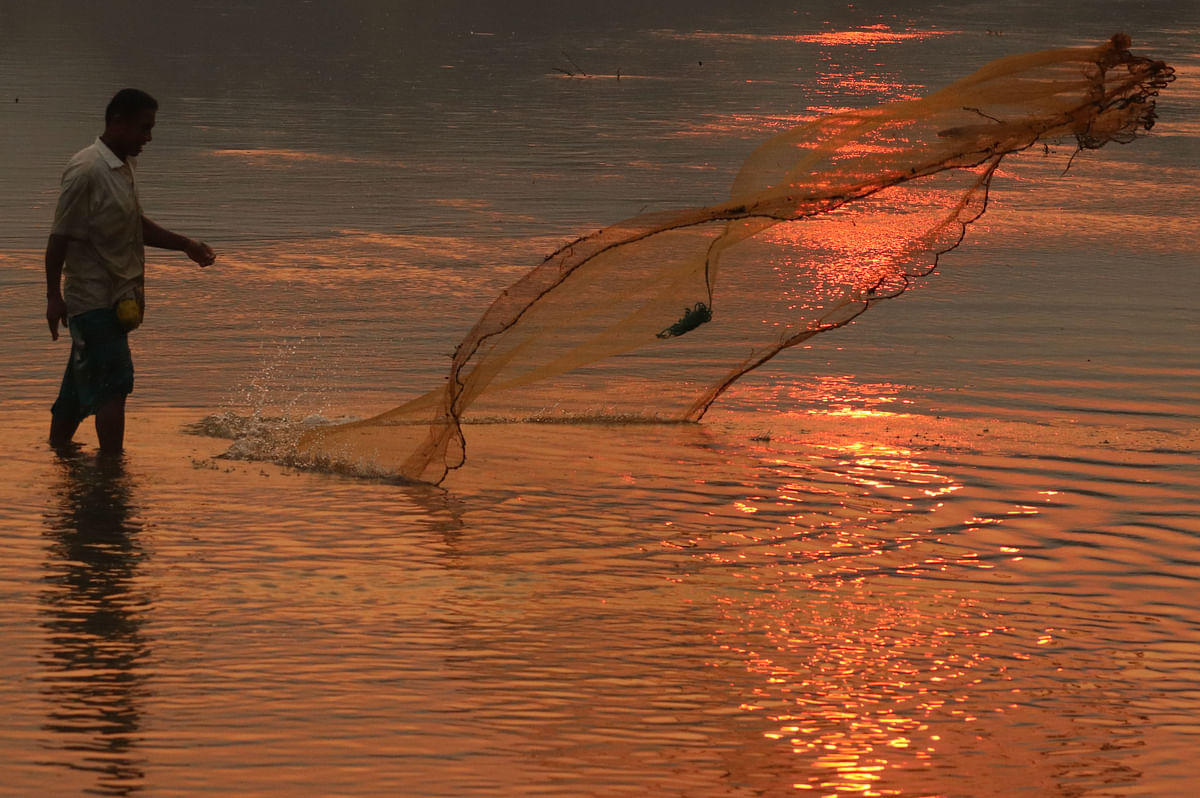 A man fishes in the river Chengi at Battoli, Khagrachhari on 1 April 2019. Photo: Nerob Chowdhury
