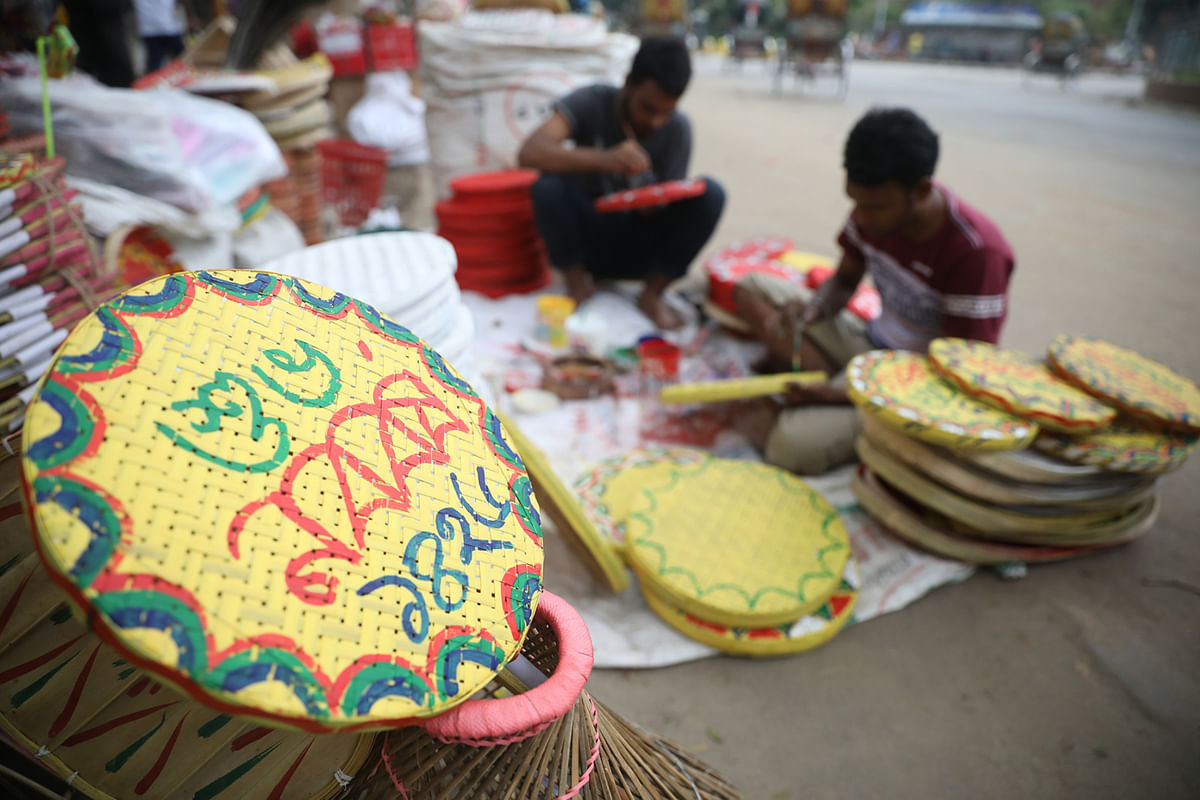Artisans prepare different handmade crafts ahead of Pahela Baishakh. The photo was taken in Dhaka University`s Doel Chattar area on 5 April. Photo: Abdus Salam