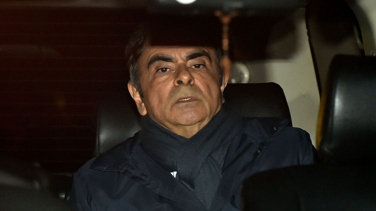 This file photo taken on April 3, 2019 shows former Nissan Chairman Carlos Ghosn leaving his lawyer`s office in Tokyo. Former Nissan boss Carlos Ghosn will remain in custody until at least April 14, a Japanese court ruled on April 5, 2019, as prosecutors quiz him over fresh allegations of financial misconduct. AFP