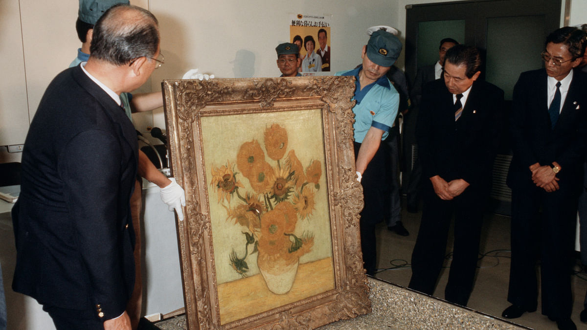 This photo taken on July 20, 1987 shows `Sunflower` by Dutch artist Vincent van Gogh being displayed upon its arrival at the Yasuda Fire and Marine Insurance headquarters in Tokyo. As Emperor Akihito prepares to step aside at the end of April 2019 and make way for his son Crown Prince Naruhito, the boom time excesses of the 1980s have long gone, replaced by lingering worry about stagnation in the world`s third-largest economy. AFP