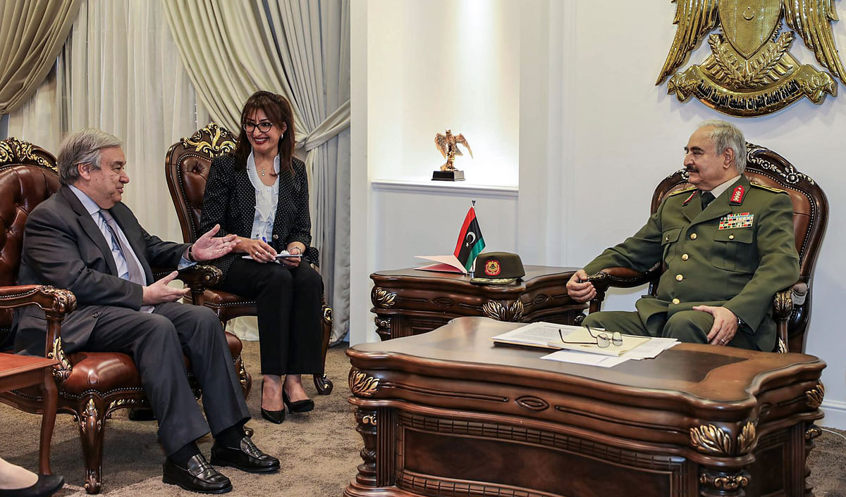 This handout photo obtained from the Libyan strongman Khalifa Haftar's self-proclaimed Libyan National Army War Information Division's Facebook page on 5 April, 2019, shows Haftar (R) meeting with United Nations Secretary General Antonio Guterres (L), at Haftar's office in the Rajma military, base 25 kilometres east of Libya's second city of Benghazi. Photo: AFP