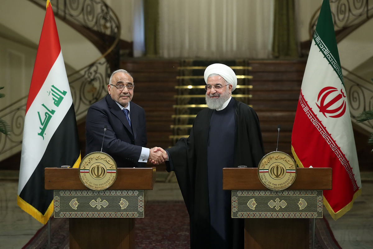 Iranian president Hassan Rouhani shake hands with Iraq`s prime minister Adel Abdul Mahdi during a news conference in Tehran, Iran, on 6 April 2019. Photo: Reuters