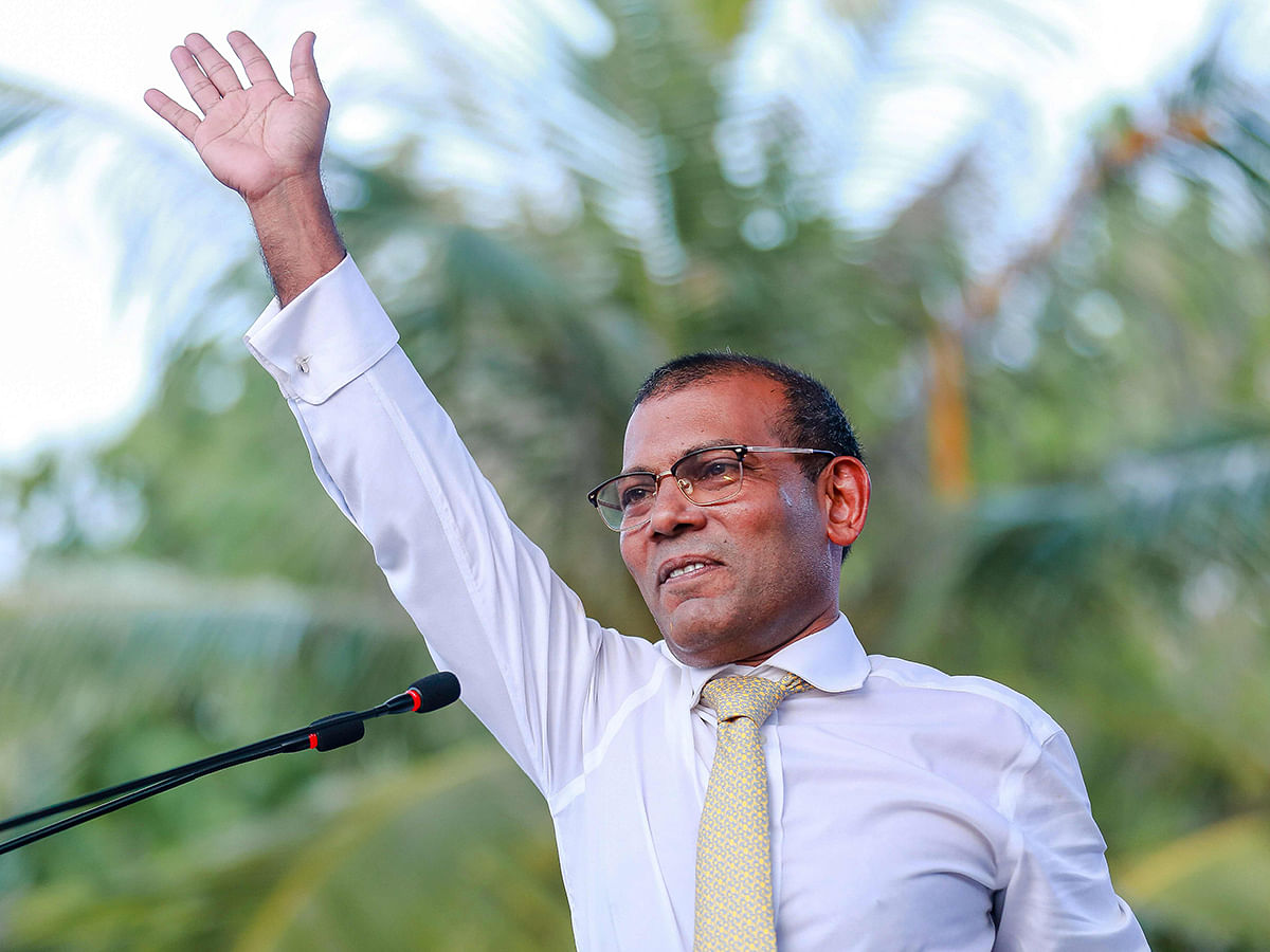 In this file photo taken on 1 November 2018 former president of the Maldives Mohamed Nasheed waves as he addresses the country after returning from exile to the Maldives, in Male. Photo: AFP