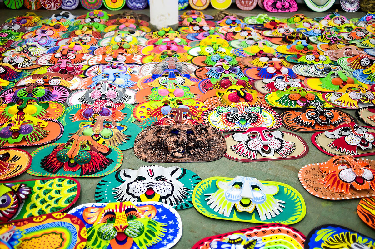 Colourful masks made by students of the Art Institute of Dhaka University lie on the ground in preparation for the Bengali New Year celebration, in Dhaka on 7 April 2019. Photo: AFP
