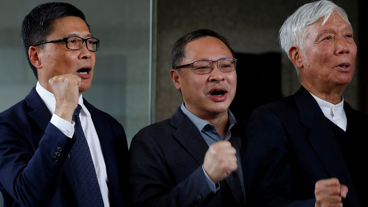 (L-R) Occupy Central pro-democracy movement founders Chan Kin-man, Benny Tai and Chu Yiu-ming chant slogans after found guilty over the Occupy Central protests, also known as `Umbrella Movement`, in Hong Kong, China on 9 April 2019. Photo: Reuters