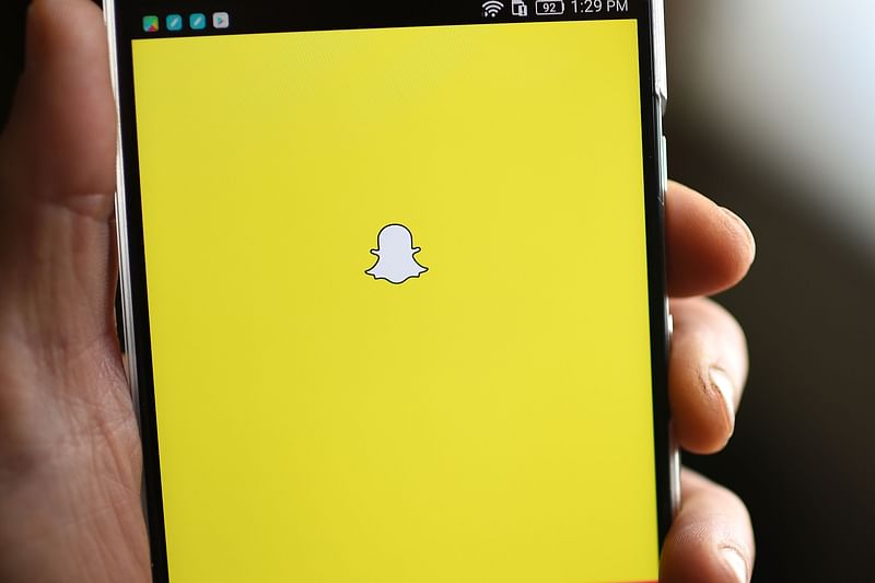 Snapchat logo is displayed on a mobile phone. Photo: AFP