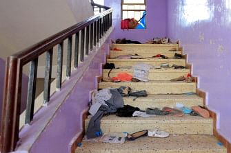 The belongings of Yemeni students are seen scattered on a staircase at a school in the capital Sanaa on 7 April 2019, following the deaths of 11 civilians including students in Yemen's capital. An AFP reporter on the ground said the injuries appeared to be the result of an explosion near a school in the city, while rebels accused a Saudi-led coalition of carrying out a deadly air strike. Photo: AFP