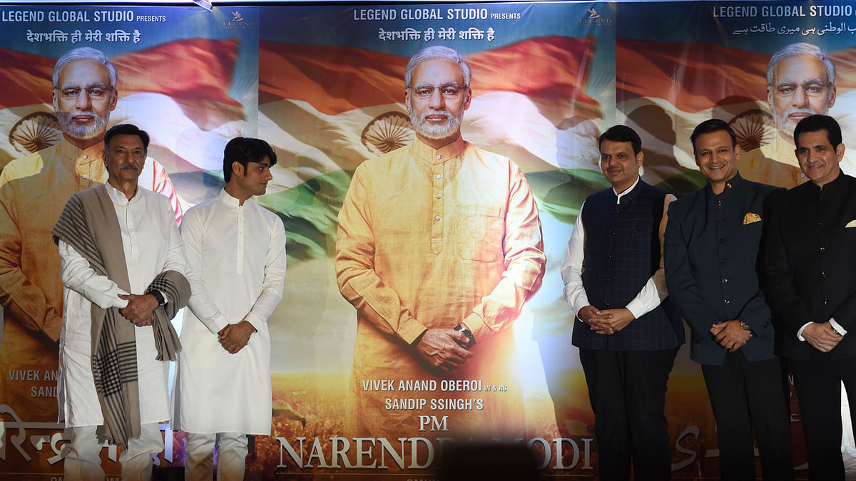 In this file photo taken on 7 January 2019, Indian actor Suresh Oberoi (L), producer Sandip S Singh (2L), Maharashtra chief minister Devendra Fadnavis (C), actor Vivek Oberoi (2R) and director Umang Kumar pose with posters of the upcoming Bollywood film `PM Narendra Modi` - a biopic on Indian prime minister Narendra Modi, during an event to launch the poster of the film in Mumbai. Photo: AFP