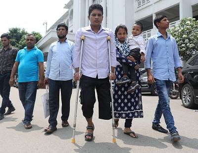 Russel Sarker along with his family members at the Supreme Court premises on Wednesday. Photo: Saiful Islam