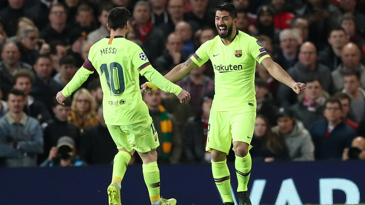 Barcelona`s Luis Suarez celebrates with Lionel Messi scoring their first goal in the Champions League Quarter Final First Leg match against Manchester United at Old Trafford, Manchester, Britain on 10 April 2019. Photo: Reuters
