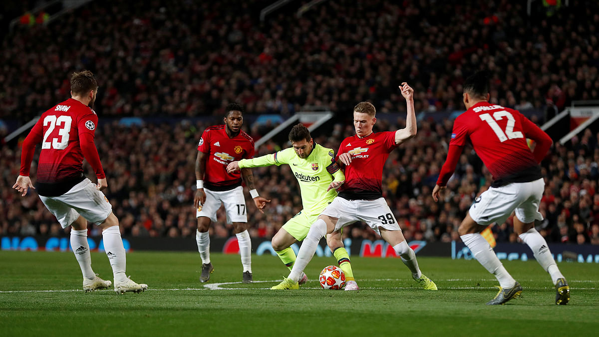 Manchester United`s Scott McTominay in action with Barcelona`s Lionel Messi in the Champions League Quarter Final First Leg match at Old Trafford, Manchester, Britain on 10 April 2019. Photo: Reuters