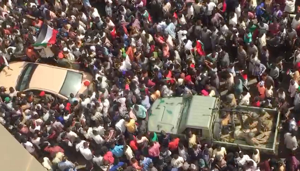People are seen in the streets after televised statement by defence minister Awad Mohamed Ahmed Ibn Auf in Khartoum, Sudan on 11 April 2019 in this still image taken from a video obtained from social media. Photo: Reuters