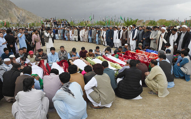 Pakistani mourners of the Shia Hazara ethnic minority offer funeral prayers for blast victims following a suicide attack at a crowded fruit market, in Quetta on 12 April 2019. Photo: AFP