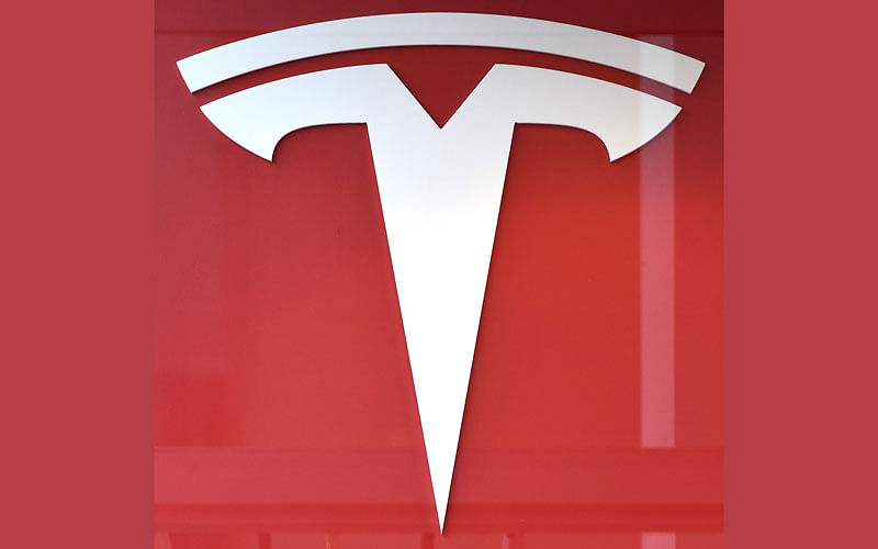 In this file photo taken on 8 February 2018 This photo shows the logo if US car maker Tesla in Brussels. Shares of Tesla fell on 11 April 2019 following a report the electric car company and electronics giant Panasonic are suspending plans to expand a battery plant due to weak demand for the vehicles. Tesla Motors, which is led by Elon Musk, finished at $268.42, down 2.8 per cent. Photo: AFP