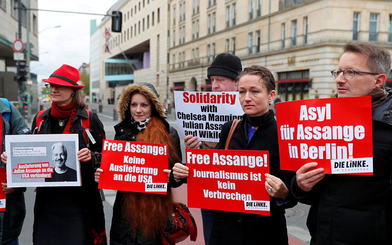 Supporters of WikiLeaks founder Julian Assange protest against his arrest, near the British embassy in Berlin, Germany on 12 April 2019. The signs read: “No extradition to the US”, “Journalism is not a crime” and “Asylum for Assange in Berlin.” Photo: Reuters