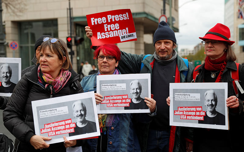 A1. Supporters of WikiLeaks founder Julian Assange protest against his arrest, near the British embassy in Berlin, Germany on 12 April 2019. The signs read: “Prevent the extradition of Julian Assange to the US!” Photo: Reuters