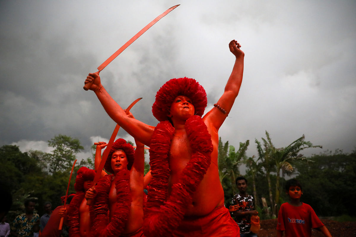 Hindu devotees join in a rally after applying colour on their body as they celebrate Lal Kach festival in Munshiganj, Bangladesh, on 13 April 2019. Photo: Reuters