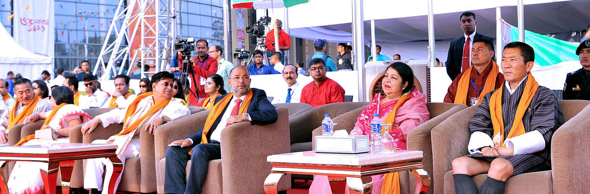Bhutanese prime minister Lotay Tshering (R) enjoys cultural programmes to celebrate Pahela Baishakh, the first day of Bengali New Year, jointly organised by cultural organisation Shurer Dhara and private television channel, Channel-i at Bangabandhu International Conference Centre in Dhaka on Sunday. Photo: PID