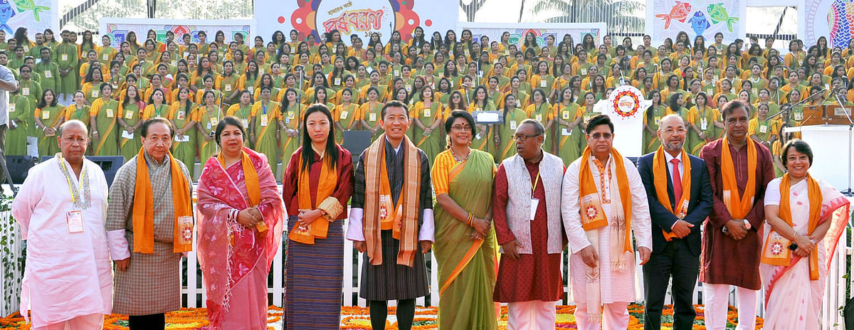 Bhutanese prime minister Lotay Tshering (R) takes part in a photo session at a cultural programme to celebrate Pahela Baishakh, the first day of Bengali New Year, jointly organised by cultural organisation Shurer Dhara and private television channel, Channel-i at Bangabandhu International Conference Centre in Dhaka on Sunday. Photo: PID
