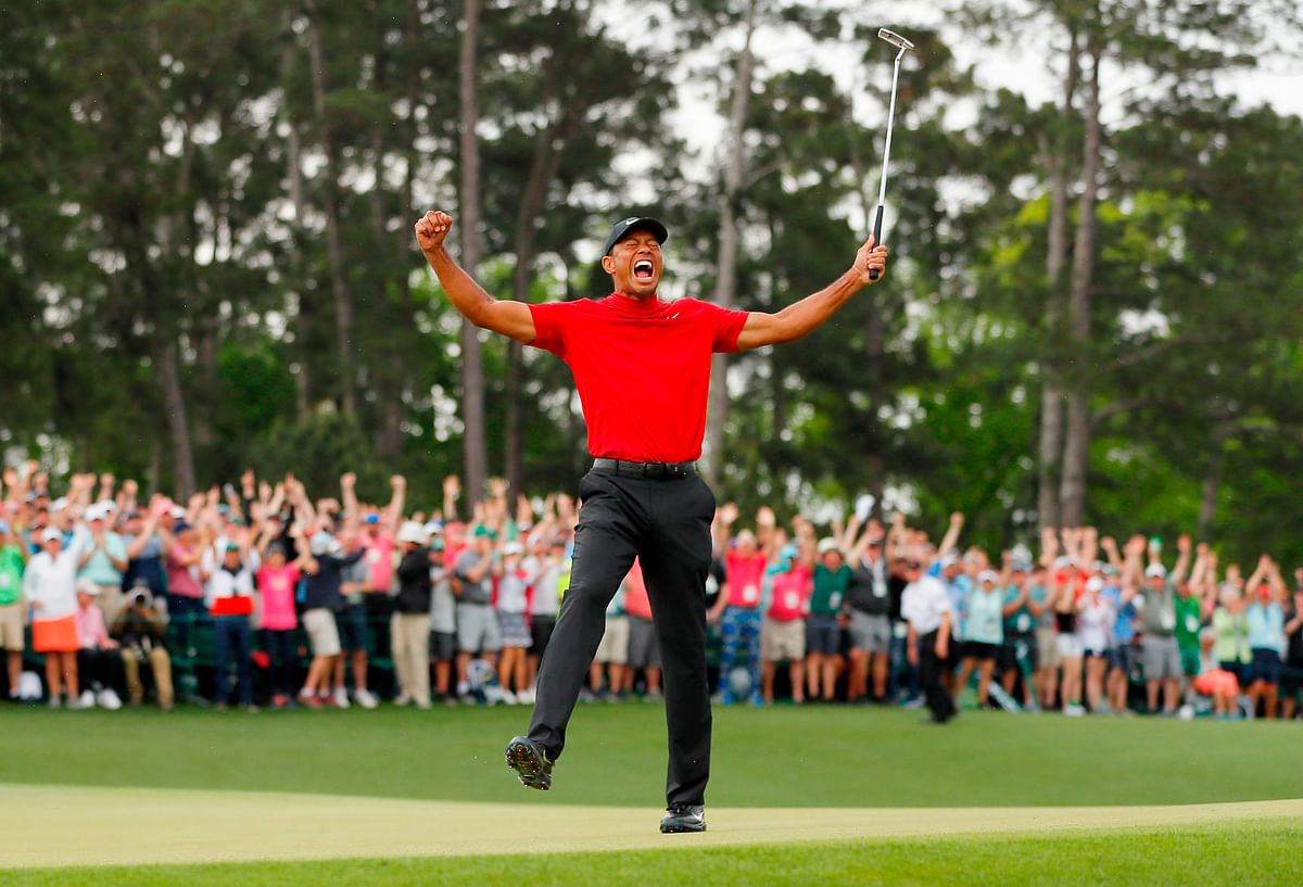 Tiger Woods of the United States celebrates after sinking his putt on the 18th green to win during the final round of the Masters at Augusta National Golf Club on 14 April, 2019 in Augusta, Georgia. Photo: AFP