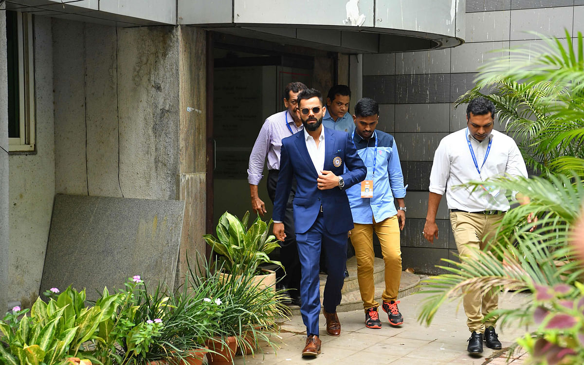Indian cricket team captain Virat Kohli (C) leaves the Board of Control for Cricket in India (BCCI) headquarters after attending the ICC Cricket World Cup team selection meeting in Mumbai on 15 April 2019. Photo: AFP