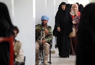 A Huthi fighter guards a polling station in the capital Sanaa on 13 April 2019, during by-elections held by Huthi rebels to replace 24 `deputies` from their assembly after the deaths and defections of former elected officials. Photo: AFP