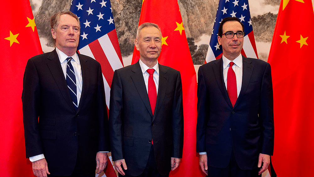 In this file photo taken on 28 March 2019 China`s vice premier Liu He (C) poses for a photo with US Treasury Secretary Steven Mnuchin (R) and US Trade Representative Robert Lighthizer (L) at Diaoyutai State Guesthouse in Beijing. Photo: AFP