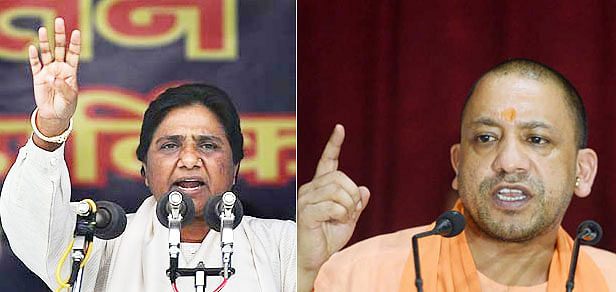 Dalit leader Mayawati and BJP leader Yogi Adityanath. AFP File Photo