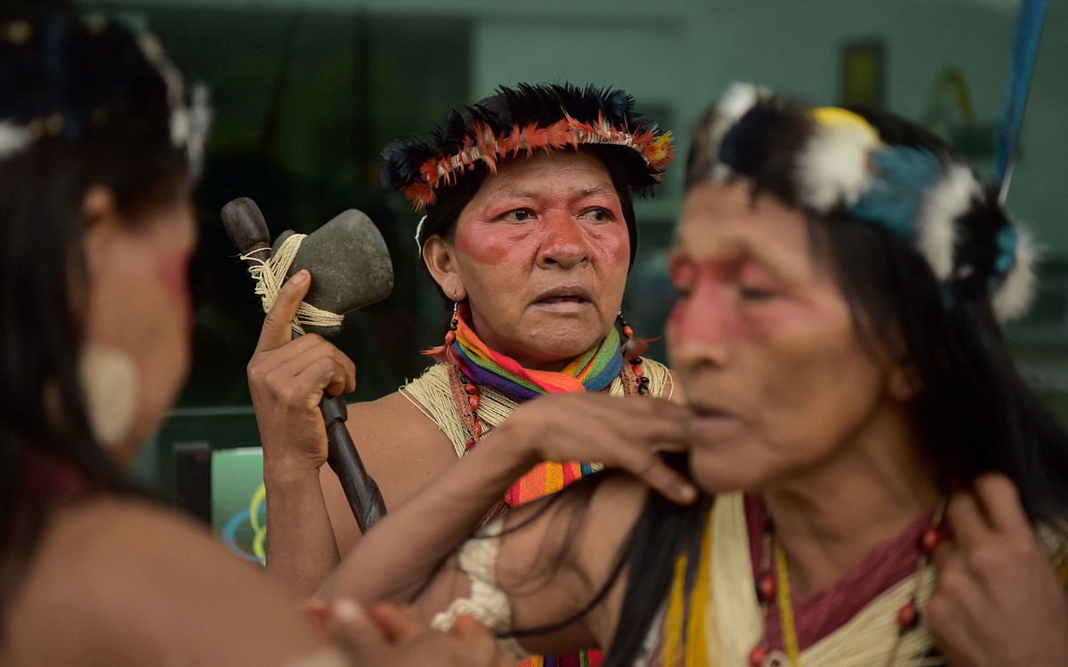 Waorani indigenous people arrive at provincial courthouse in Puyo, Ecuador, where a legal bid to halt the government’s plans to open up their lands to oil exploration is taking place, on 13 April 2019. Photo: AFP