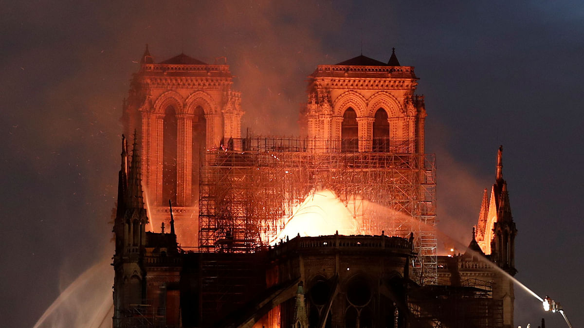 The steeple collapses as smoke and flames engulf the Notre-Dame Cathedral in Paris on 15 April 2019. Photo: AFP