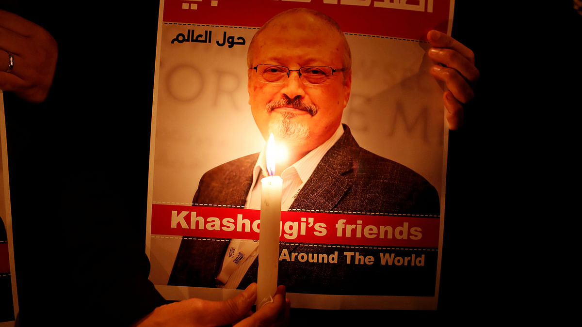 A demonstrator holds a poster with a picture of Saudi journalist Jamal Khashoggi outside the Saudi Arabia consulate in Istanbul, Turkey on 25 October 2018. Reuters File Photo