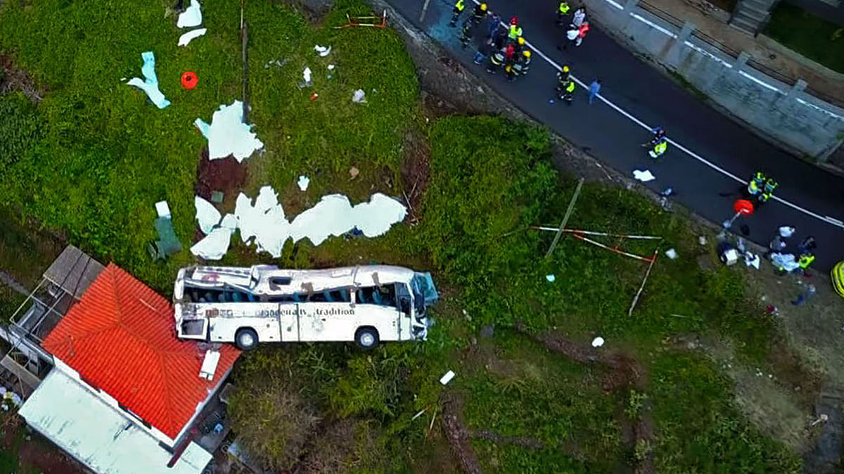 A video grab obtained from drone footage shows the wreckage of a tourist bus that crashed on 17 April 2019 in Canico, on the Portuguese island of Madeira. At least 28 people were killed when a tourist bus crashed on the Portuguese island of Madeira, the local mayor told local media. The regional protection service did not confirm the toll when questioned by AFP. Photo: AFP