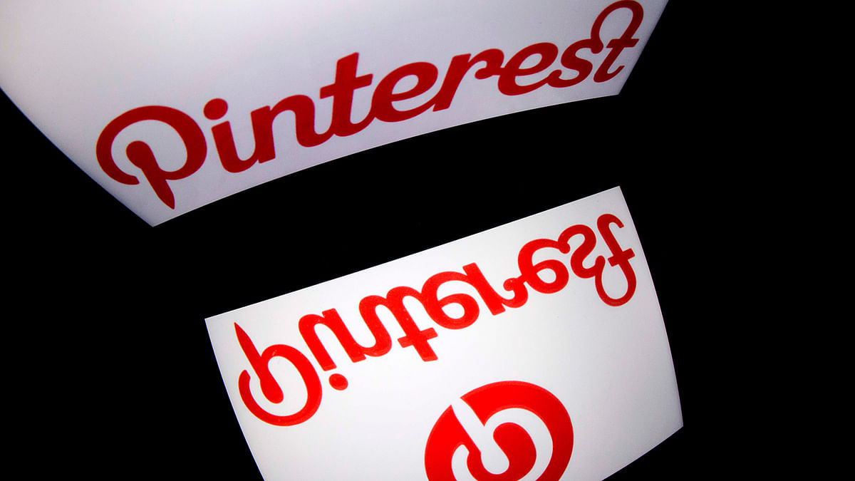 In this AFP file photo taken on 2 January 2014 the logo of mobile app `Pinterest` is displayed on a tablet in Paris.