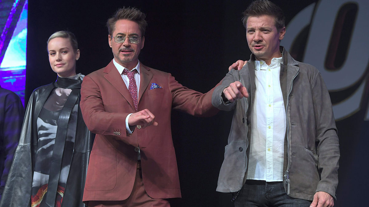Robert Downey Jr. (C) and Jeremy Renner (R) gesture as Brie Larson (L) looks on during Marvel Studios` `Avengers: Endgame` Asia press conference in Seoul on 15 April 2019. Photo: AFP