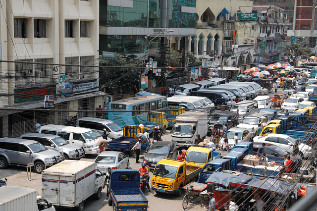 Road narrowed due to cars parked at both sides inside Karwan Bazar. Photo: Dipu Malakar