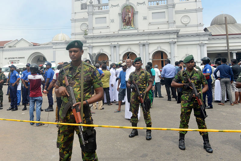 Sri Lankan security personnel keep watch outside the church premises following a blast at the St. Anthony`s Shrine in Kochchikade in Colombo on 21 April 2019. Photo: AFP