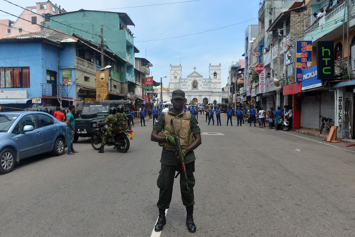 Sri Lankan security personnel keep watch outside the church premises following a blast at the St. Anthony`s Shrine in Kochchikade, Colombo on 21 April 2019. Photo: AFP