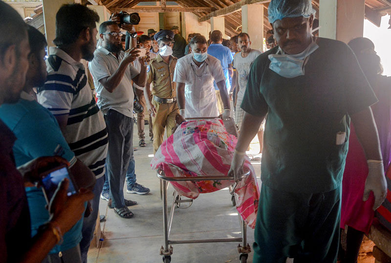 Hospital staff push a trolley with a casualty after an explosion at a church in Batticaloa. Photo: Reuters