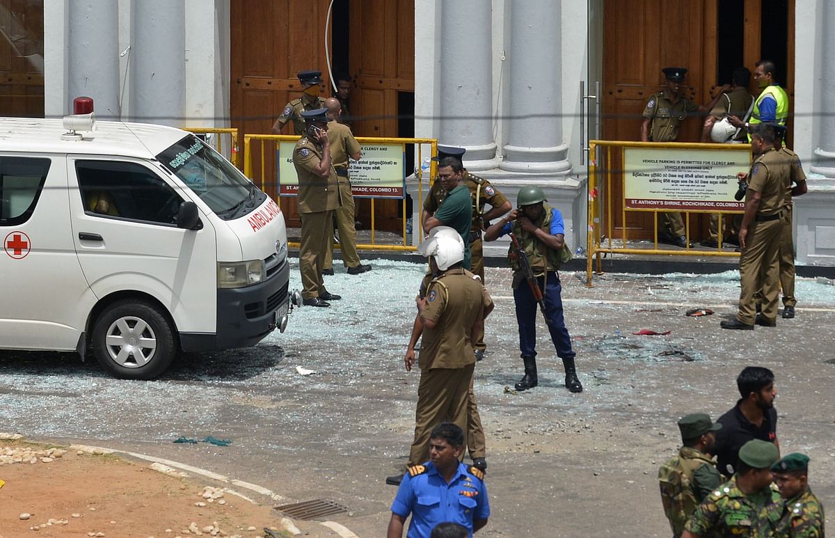 Sri Lankan security personnel stand next to an ambulance outside St. Anthony`s Shrine in Kochchikade in Colombo on 21 April 2019 following a blast at the church. Photo: AFP