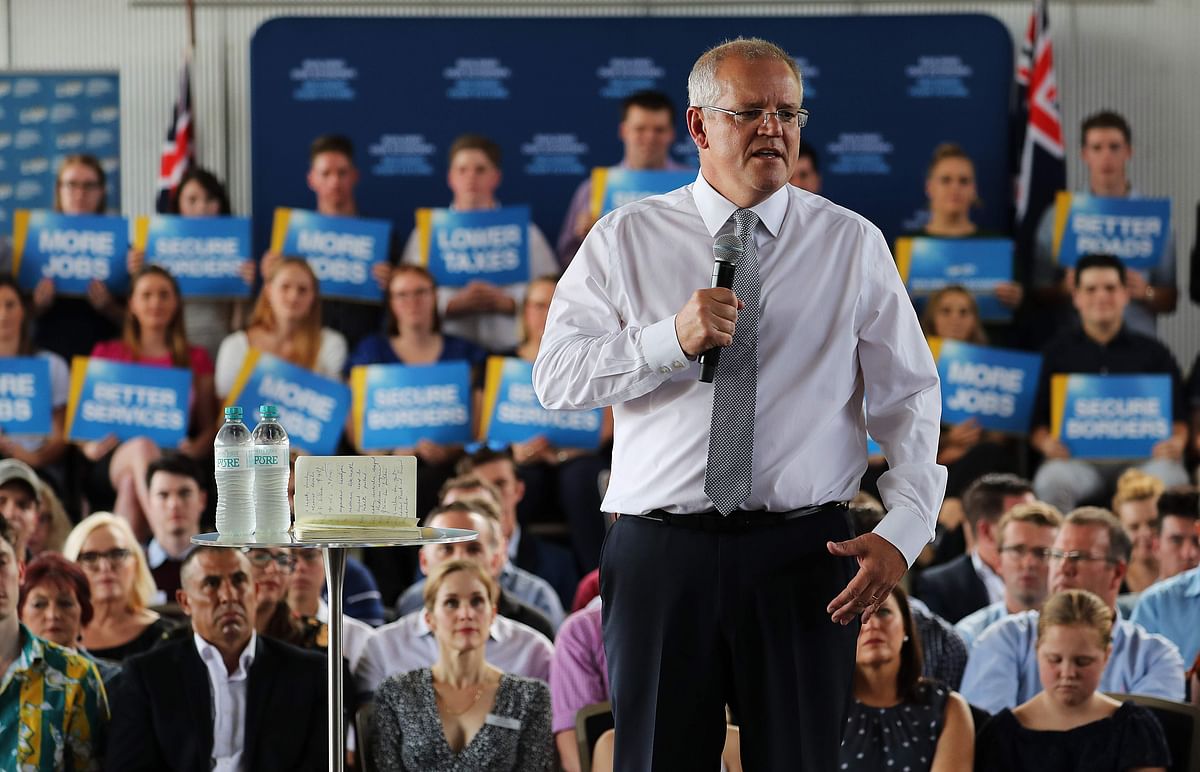 This handout photograph taken and released on 14 April 2019 by the Australian prime minister`s office shows Australia`s prime minister Scott Morrison (C) addressing supporters at an election launch rally in Brisbane. Photo: AFP