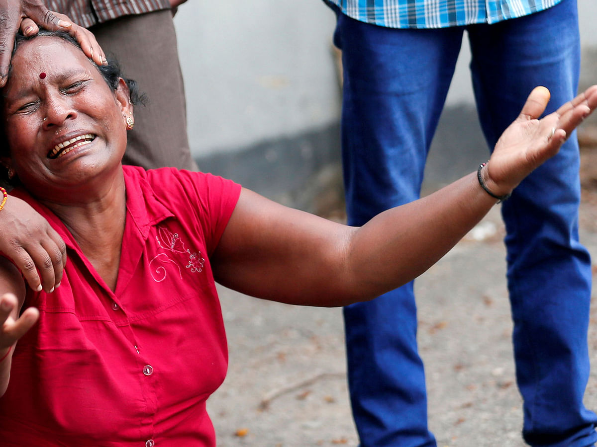 A relative of a victim of the explosion at St. Anthony`s Shrine, Kochchikade church, reacts at the police mortuary in Colombo, Sri Lanka on 21 April 2019. Photo: Reuters