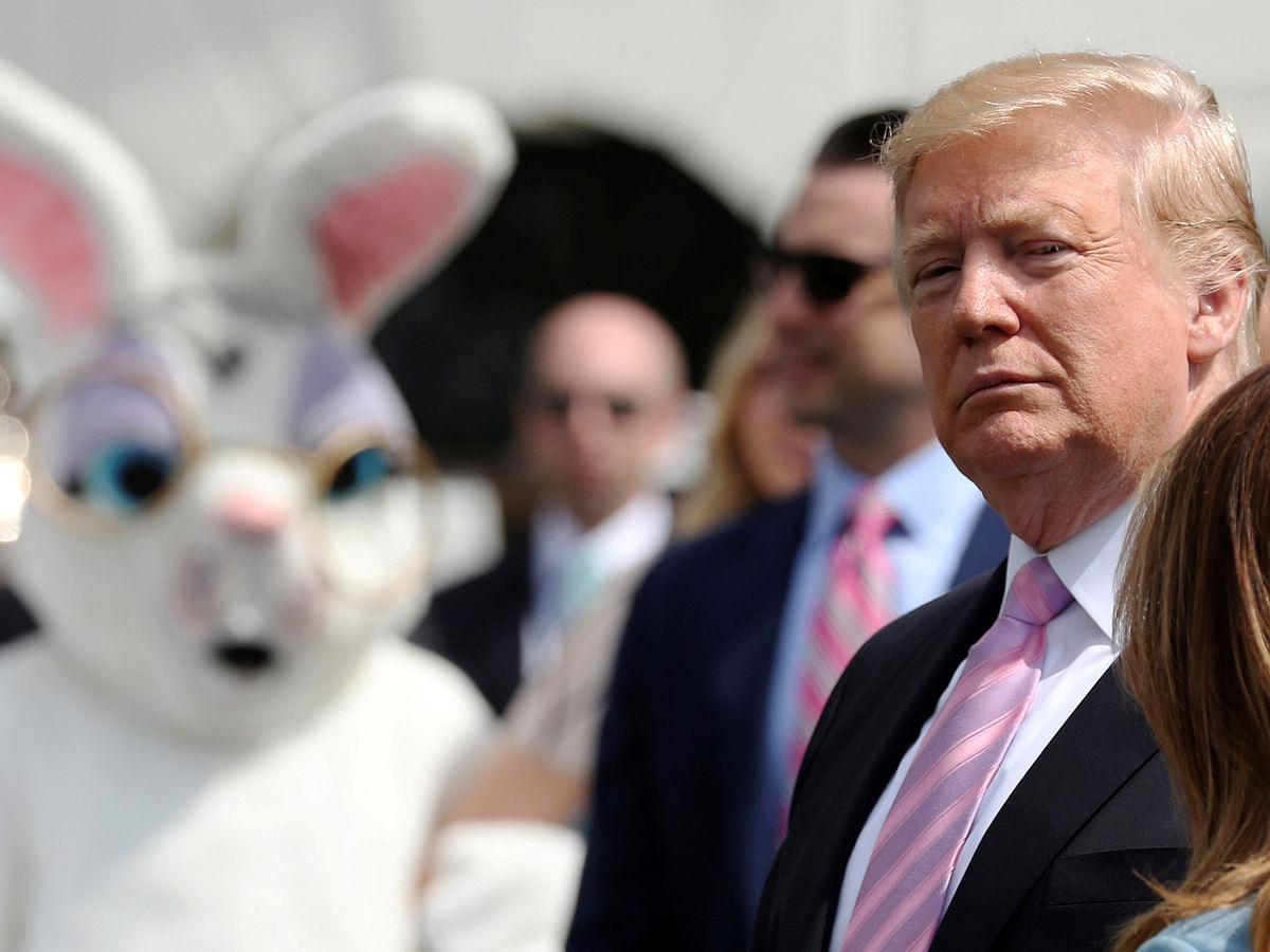 A person in an Easter Bunny costume looks on as US president Donald Trump attends the 2019 White House Easter Egg Roll in Washington, US on 22 April. Photo: AFP