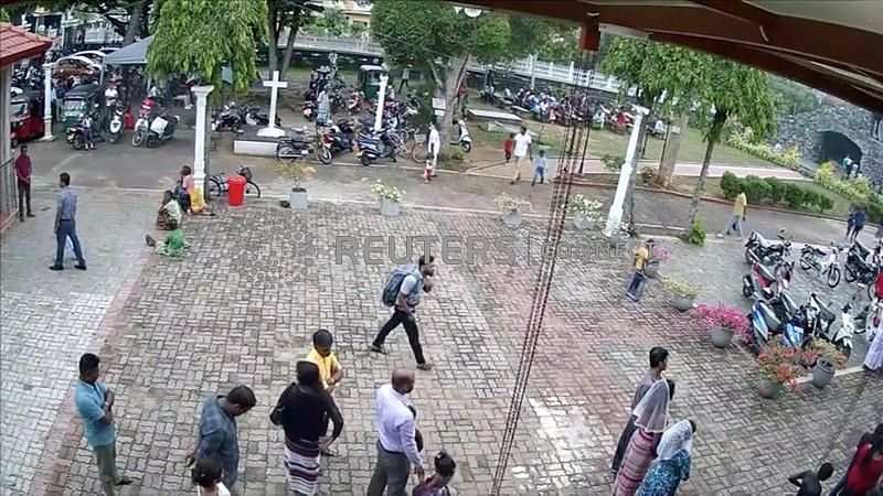 A suspected suicide bomber carries a backpack on a street in Negombo, Sri Lanka 21 April 2019 in this still image taken from a CCTV handout footage of Easter Sunday attacks released on 23 April 2019. CCTV/Siyatha News via Reuters