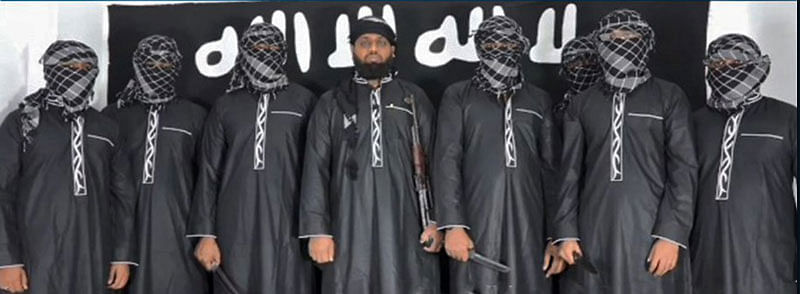 An image grab taken from a press release issued on 23 April 2019 by the Islamic State (IS) group’s propaganda agency Amaq, allegedly shows eight men it said carried out a string of deadly suicide bomb blasts on Easter Sunday in Sri Lanka, lined up at an undisclosed location. Photo: AFP