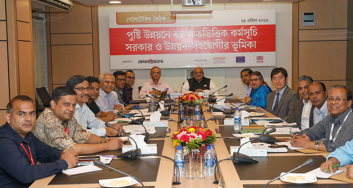 Participants pose for photograph at a roundtable titled ‘Multisectoral nutrition programming for improving nutrition: Role of GoB and development partners’ at CA Bhaban in Karwan Bazar on Wednesday. Photo: Prothom Alo
