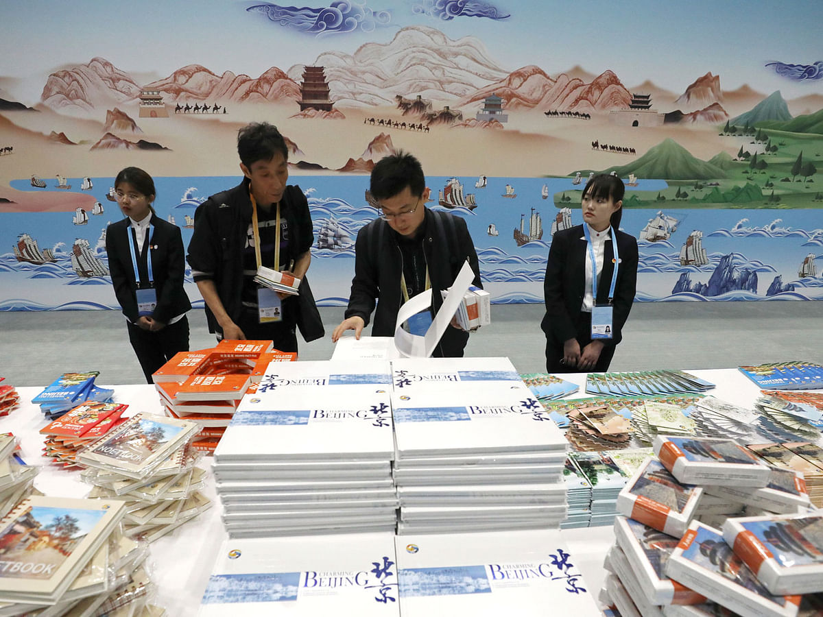 Journalists look at the items displayed at the media centre for the second Belt and Road Forum for International Cooperation at the China National Convention Centre, in Beijing, China on 23 April 2019. Photo: Reuters